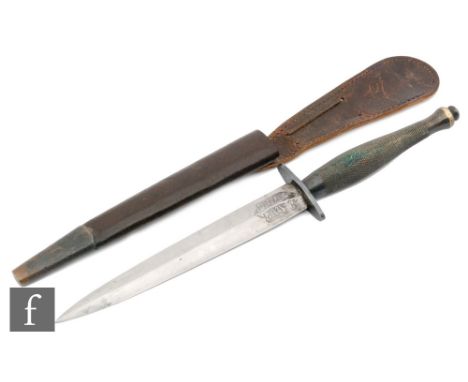 A World War Two Fairbarn-Sykes Second Pattern 'Fighting Knife', with a brass knurled or checkered grip with a rounded pommel 