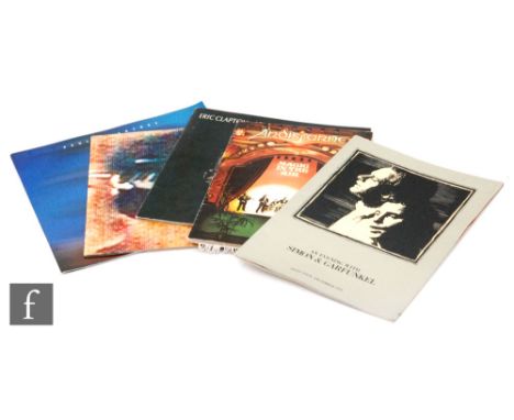 A collection of signed and unsigned music programmes, to include Eric Clapton, Journeyman, signed, Lindisfarne, Magic in the 