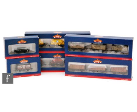 A collection of twenty three items of OO gauge Bachmann rolling stock, six being multipacks, including cement wagons, plank w