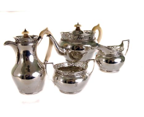 An electroplated four piece tea service by Thomas Bradbury & Sons,  with pierced scroll borders, and ivory loop handles, and 