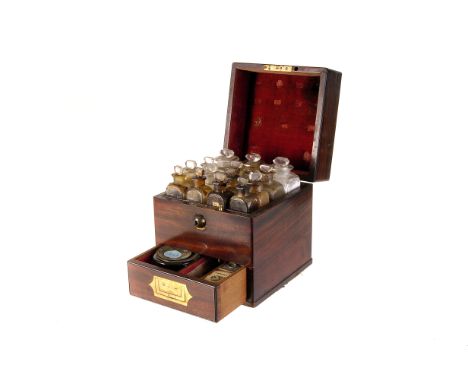 A Victorian mahogany travelling medicine case  by Phillips Brothers, London, complete with original glass ointment bottles, b