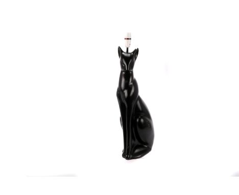 A ceramic lamp base modelled as a seated cat,  with lead and fittings, 67cm high 