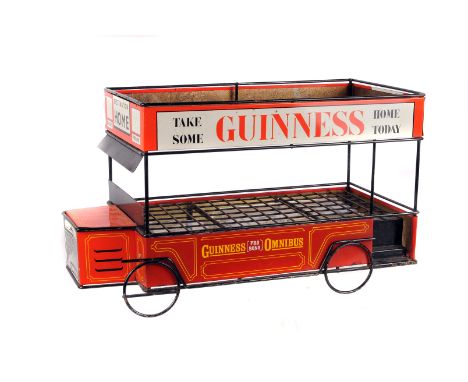 A tin plate Guinness bottle basket,  in form of a tram, together with two limited edition Royal Doulton Guinness Toucan figur