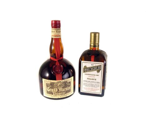 A collection of vintage liqueurs, including Grand Marnier, Cointreau, and Tia Maria (4) 