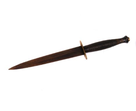 A WWII Fairbairn Sykes fighting knife,  in leather scabbard 