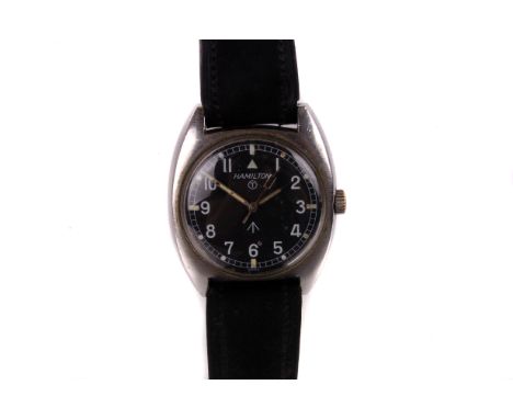 A 1970s Hamilton W10 stainless steel British Army issue field watch, the one piece tonneau case with signed black dial, white