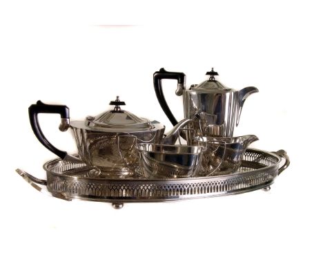 An Art Deco four piece electroplated oblong tea service,  together with a galleried twin handled tray (5) 