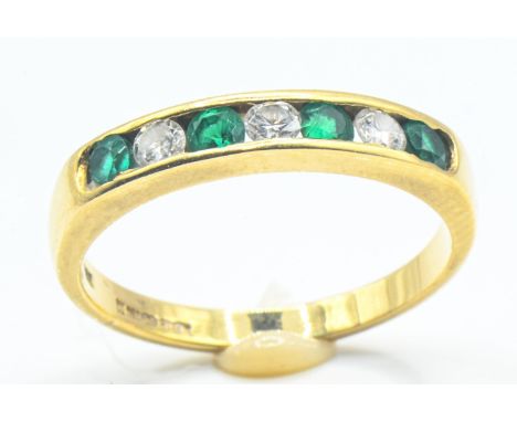 18ct gold, diamond & green stone half hoop channel-set ring, London import hallmark, size J, gross weight 2.25 gramsNo date l