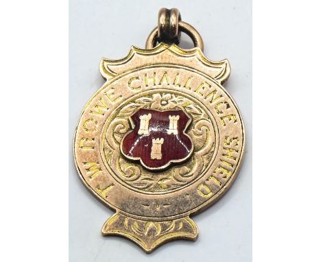 9ct gold and enamel fob medal, inscribed 'T W ROWE CHALLENGE SHEILD', hallmarked Birmingham 1919, length including bale 38mm,