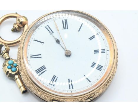 14ct gold cased ladies open face key wind fob watch, the white enamel dial with Roman numerals, the floral engraved case stam