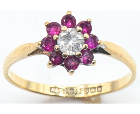 9ct gold, pink spinel and white stone flowerhead cluster ring, hallmarked Birmingham 1971, size O1/2, gross weight 1.43 grams