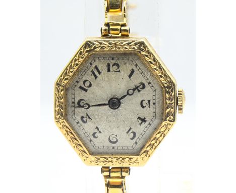 Art Deco 18ct gold cased ladies wristwatch, with laurel leaf decorated octagonal-shaped case, the engine-turned silvered dial