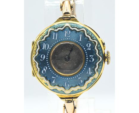 18ct gold and enamel cased ladies watch, silver dial, with blue and white enamel surround with Arabic numerals, case back hal