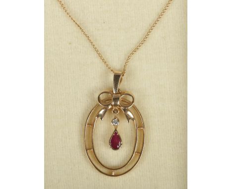 A 9ct gold ruby and diamond pendant on 9ct gold chain.  