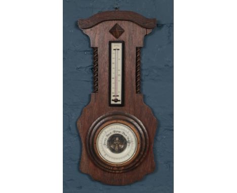 Antique Oak Barometer with barley twist carving. Marked on back but undistinguishable. H: 56cm, W: 26cm.  Condition fair. Spl
