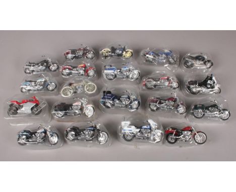 A box of twenty three die-cast motorcycles. To include  Suzuki, Harley Davidson, and BMW etc.  Condition good. One bike has t