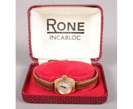 A ladies manual Rone wristwatch with leather strap in original case.  Not running.
