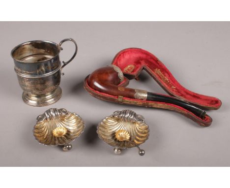 A collection of silver and a silver mounted pipe. Includes a pair of shell salts assayed Chester 1983 by James Deakin &amp; S