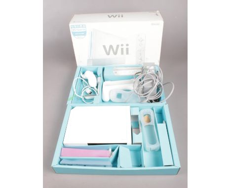 A boxed Nintendo Wii console with some accessories.  Unsure if working.