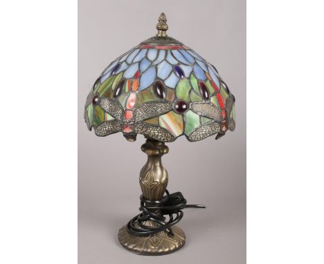 A Tiffany style lead glazed table lamp with lead glazed shade decorated with dragonflies. (35cm tall)  