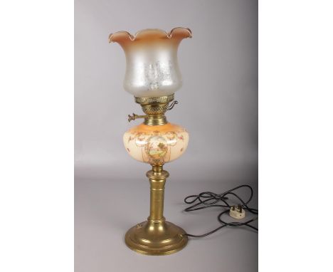 A converted Victorian Young's brass oil lamp. Comprising of a decorative ceramic reservoir and a clear and light brown etched