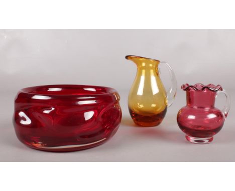 A group of Whitefriars glass ware. To include a Ruby Red knobbly bowl (12.5cm diameter), a small amber jug (10.5cm height), s