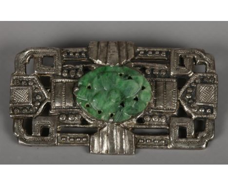 A silver Chinese brooch. With green hardstone centre.  