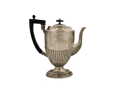A Victorian silver half fluted pedestal hot water jug by John Millward Banks. With ebonised handle and finial, Chester 1898, 
