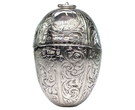 An unusual Victorian silver egg shaped vinaigrette by Aston & Son. With foliate engraved decoration, Birmingham 1858, length 
