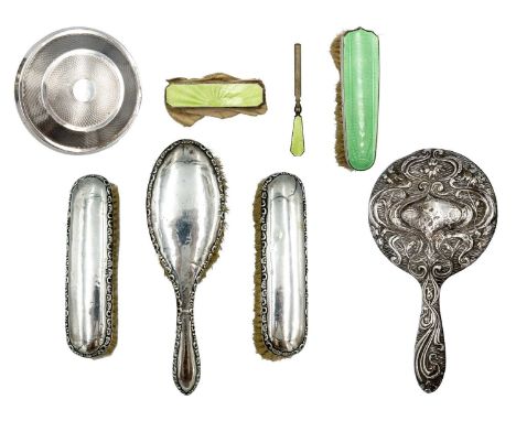 A selection of silver dressing table wares. To include a 1930's engine turned lidded black celuloid 'Chic-pac deluxe model' p