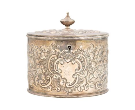 A good George III silver tea caddy by William Plummer.  Of oval section, the hinged lid with urn finial and revealing two sec