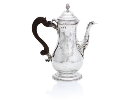 A George II Coffee Pot,Maker's mark unclear, London, 1759 On moulded pedestal foot, the pear-shaped body engraved with a roco