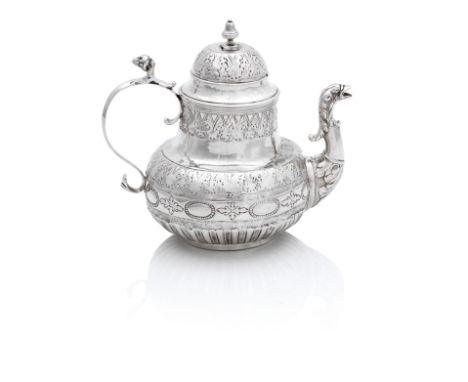 An Dutch Silver Teapot18th Century of pear shape with animal headed spout, chased with formal band of foliage, height 14.5cm,