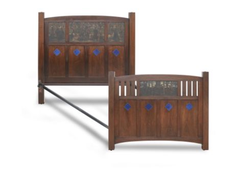 James Watterston Herald (British, 1859-1914)A pair of Heal's double bed endsThe mahogany head and foot boards inset with pane
