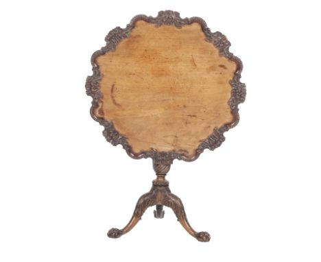 A George III style rococo mahogany tripod tablethe shaped circular tilt top carved with beaded scrolling acanthus edge,   78c