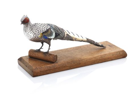 A Japanese Enamelled Silver PheasantMeiji Shown standing on a wooden plinth, signed, some damage to the enamel, 27 cms long, 