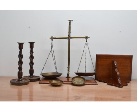 A collection of works of art, comprising a set of wood and brass kitchen scales 50cm high, a pair of oak and brass topped bar