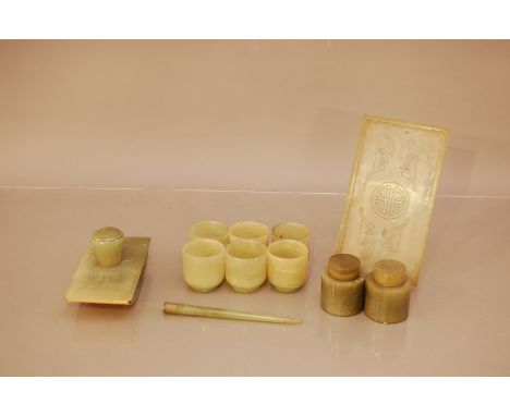 A collection of 20th century jade items, including six small cups, two lidded pots, an ink blotter (14)