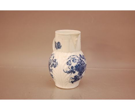 A Caughley blue and white transfer printed jug, C.1790. with mask head spout, marked to the base 18cm high, heavily restored