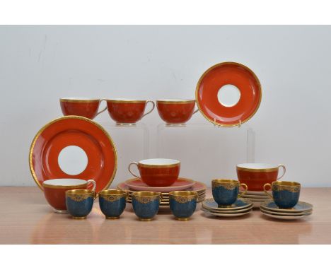 An art deco royal Worcester six person part coffee set, comprising six cups, saucers and side plates, red with gilt design, t