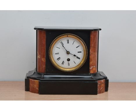 An early 20th century marble mantle clock, enamel dial with roman numerals, 20cm H x 25cm W, with pendulum and winder