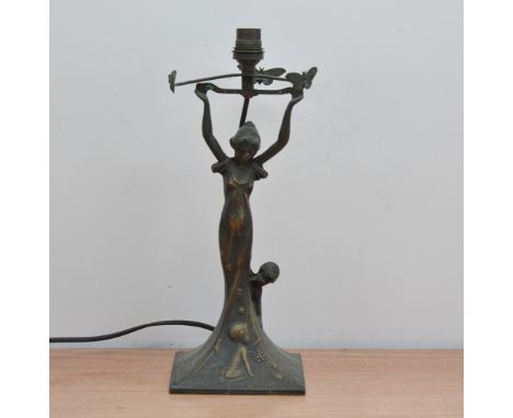 An art deco style bronzed metal lamp shade, depicting a lady as the column, with three butterflies on a square base 34.5cm hi