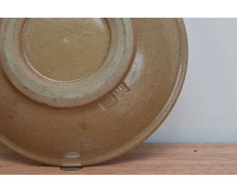 A small brown glazed stoneware studio pottery bowl,  with impressed marks to the underside for Bernard Leach and St. Ives, br