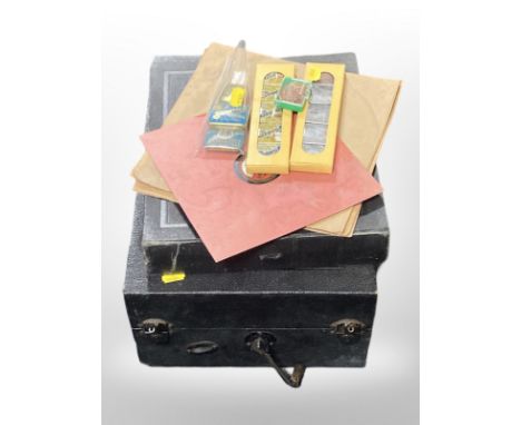 A Columbia table top record player,78's and a collection of record player needles in tins 