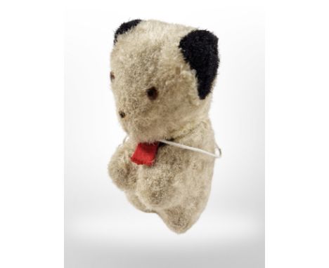 A vintage novelty sewing tape measure in the form of Sooty, height 9.5cm.
