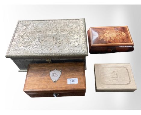 A Dunhill cigarette box, inlaid musical trinket box, oak box and an embossed metal box, largest 31 cm 