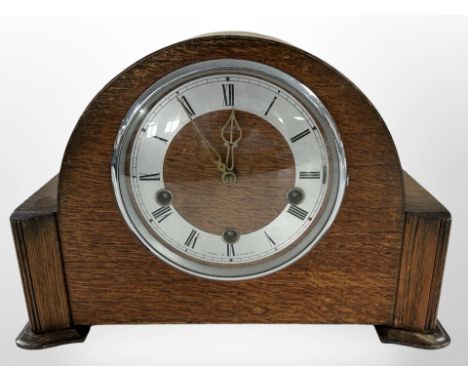 A Smiths Art Deco oak cased mantel clock, width 31 cm 