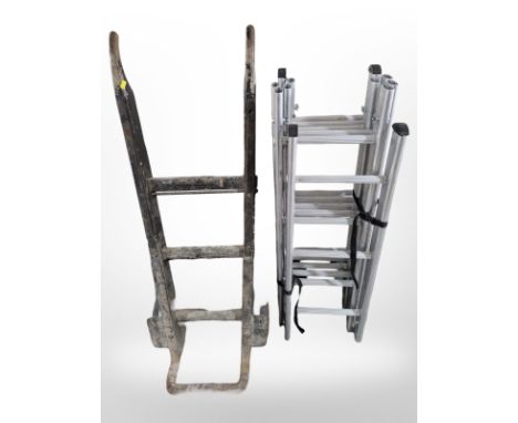 An antique porter's sack barrow and an aluminium extension ladder 