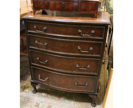 A reproduction burr walnut Serpentine fronted veneered chest of four graduating drawers, on short cabriole legs, 77cm x 63cm