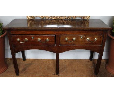 18th century low two drawer dresser of plain form. 76 x 132 x 46cm. Raised on five legs.Condition: split to top, various dent